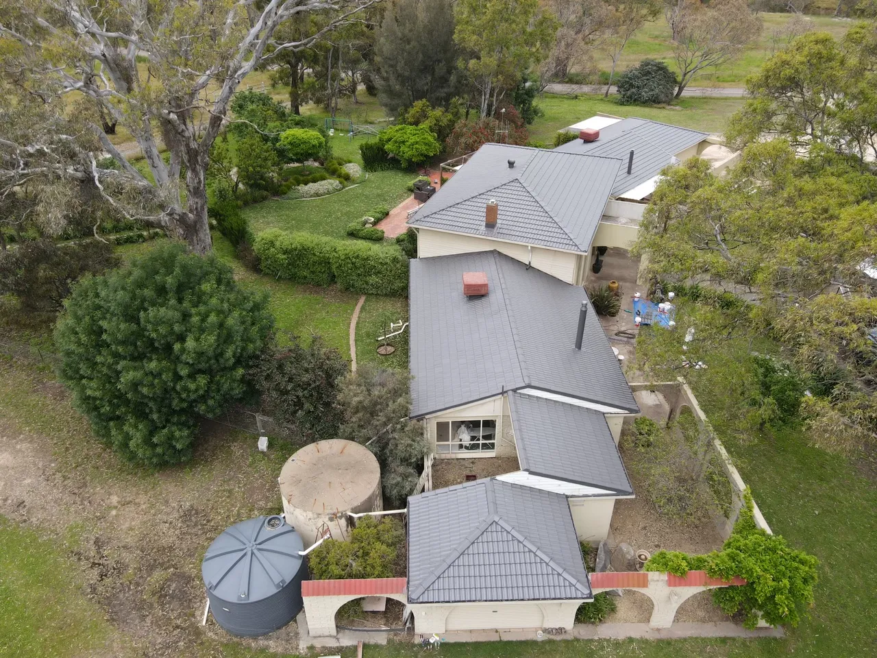 Garden side Aerial view from the garden side of a restored tile roof, showing uniform colour from the lower wings to the upper storey, tile roof restoration by Roof Restoration Services Bendigo